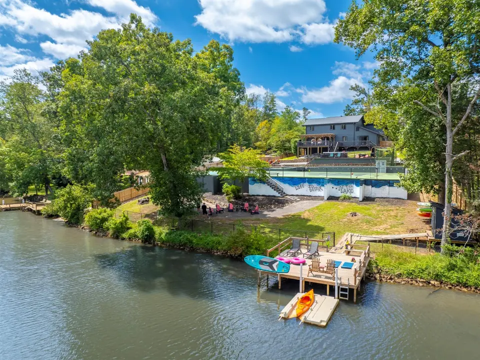 The house seen from Saluda Lake, with the dock, kayaks and paddleboards in front